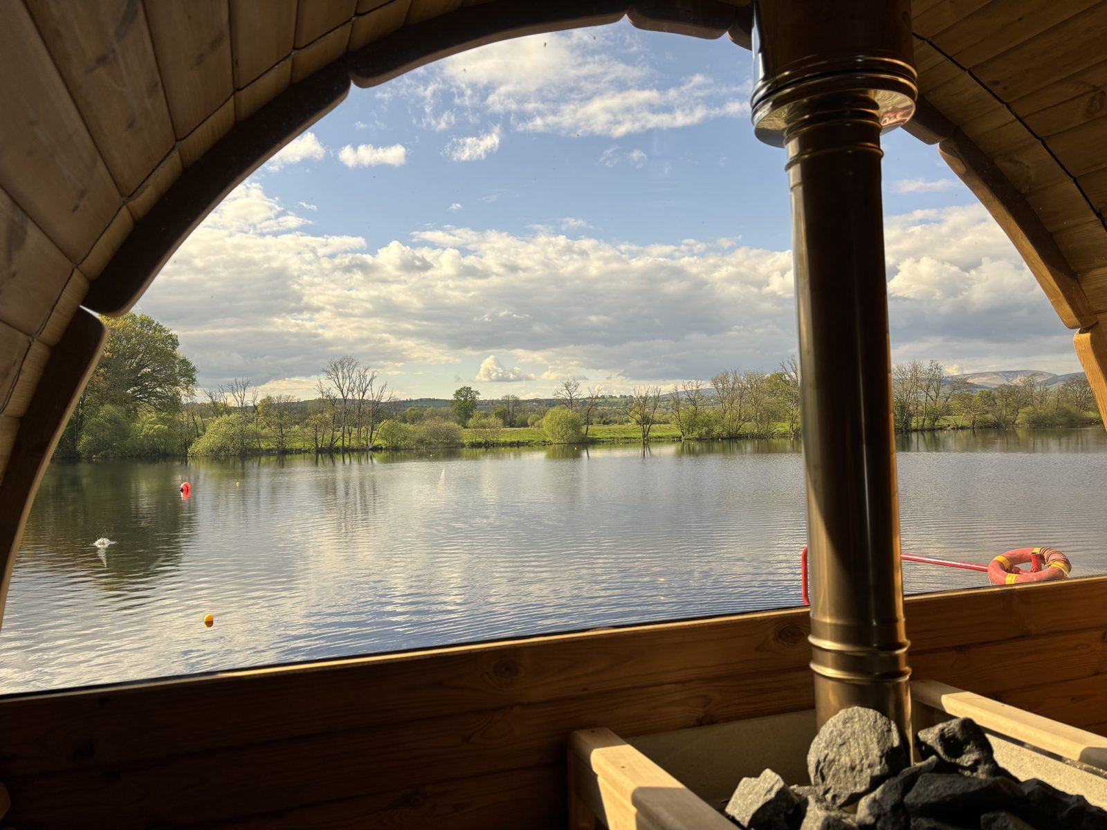 Blue sky and river through the sauna window